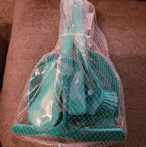 A 5 piece kitchen brush and cleaning utensils.